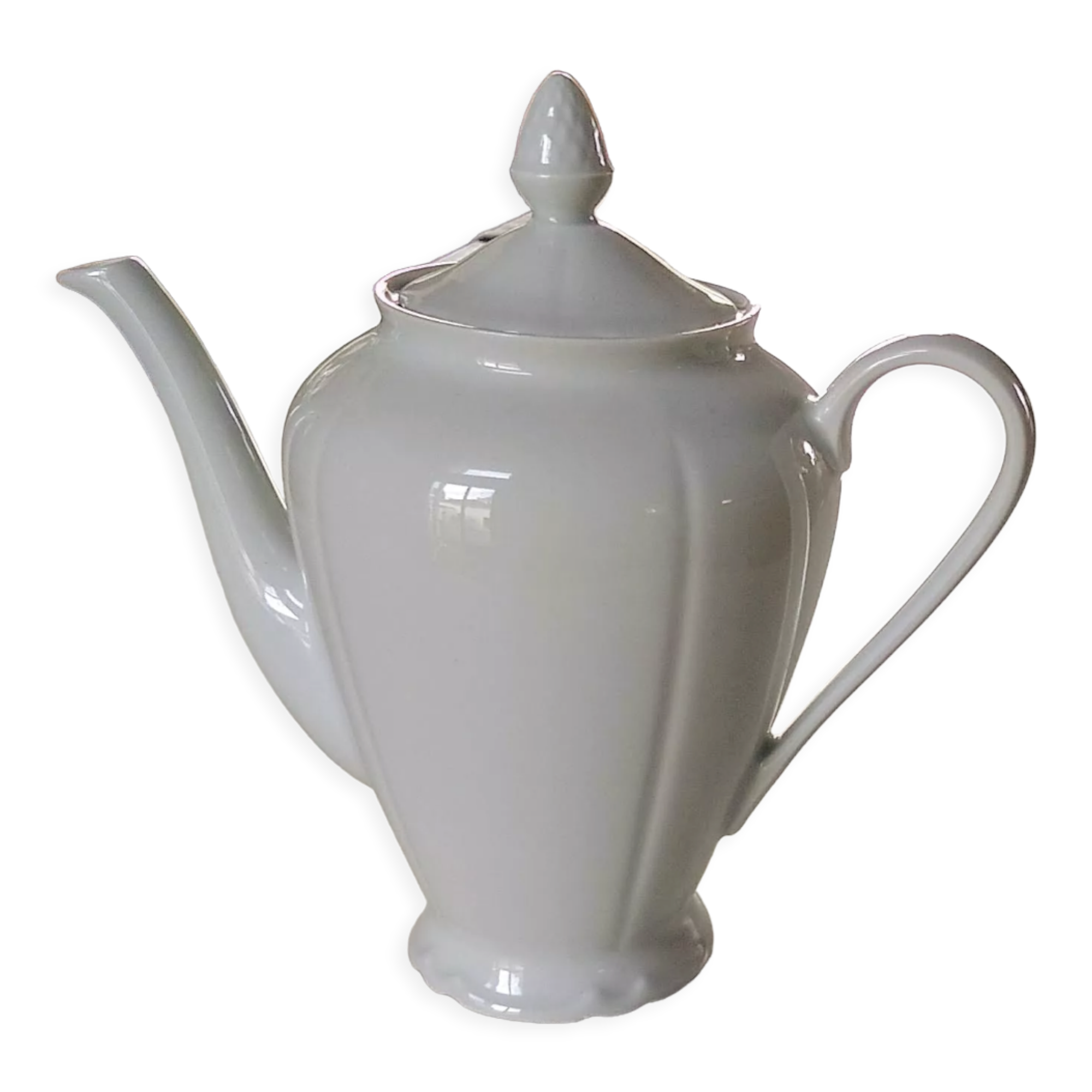 White porcelain teapot with acorn-shaped cap