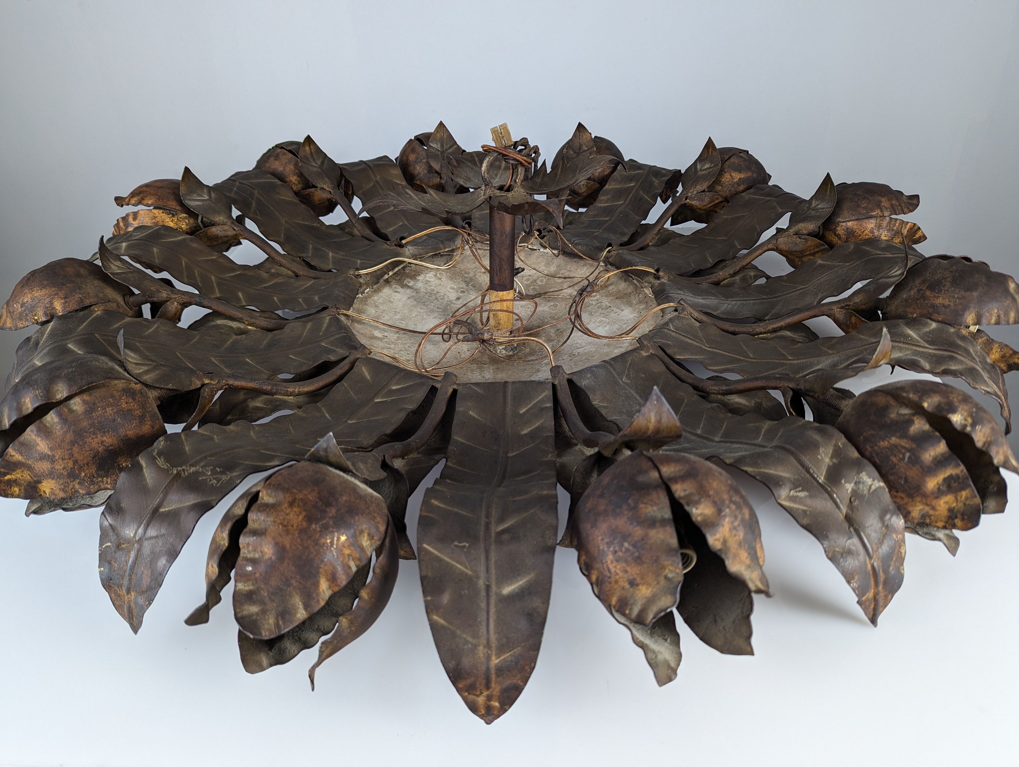 Large mid-century sunburst ceiling lamp, gilded metal with floral motif, 1950s