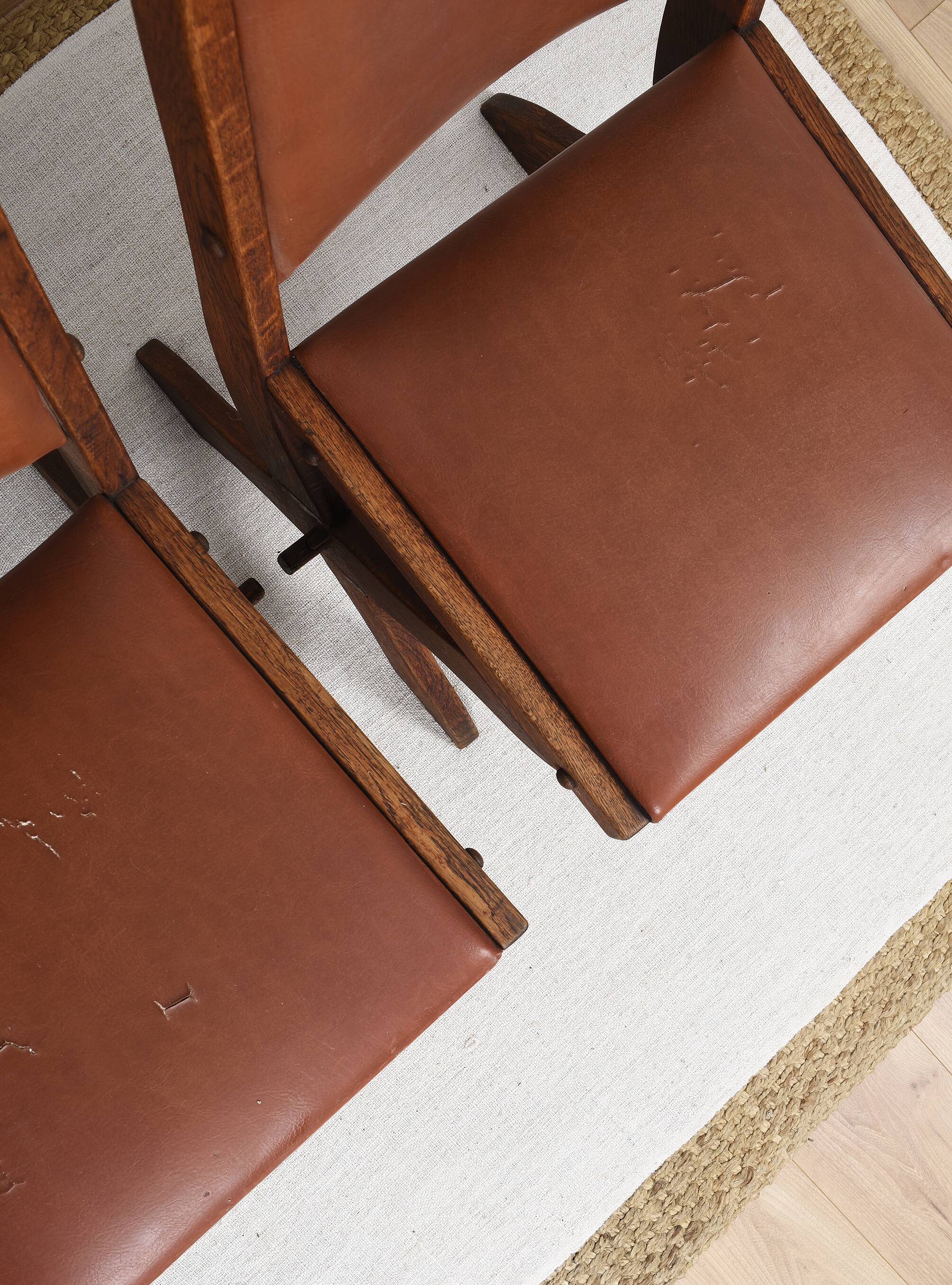 Pair of brutalist style chairs, in wood and leather.
