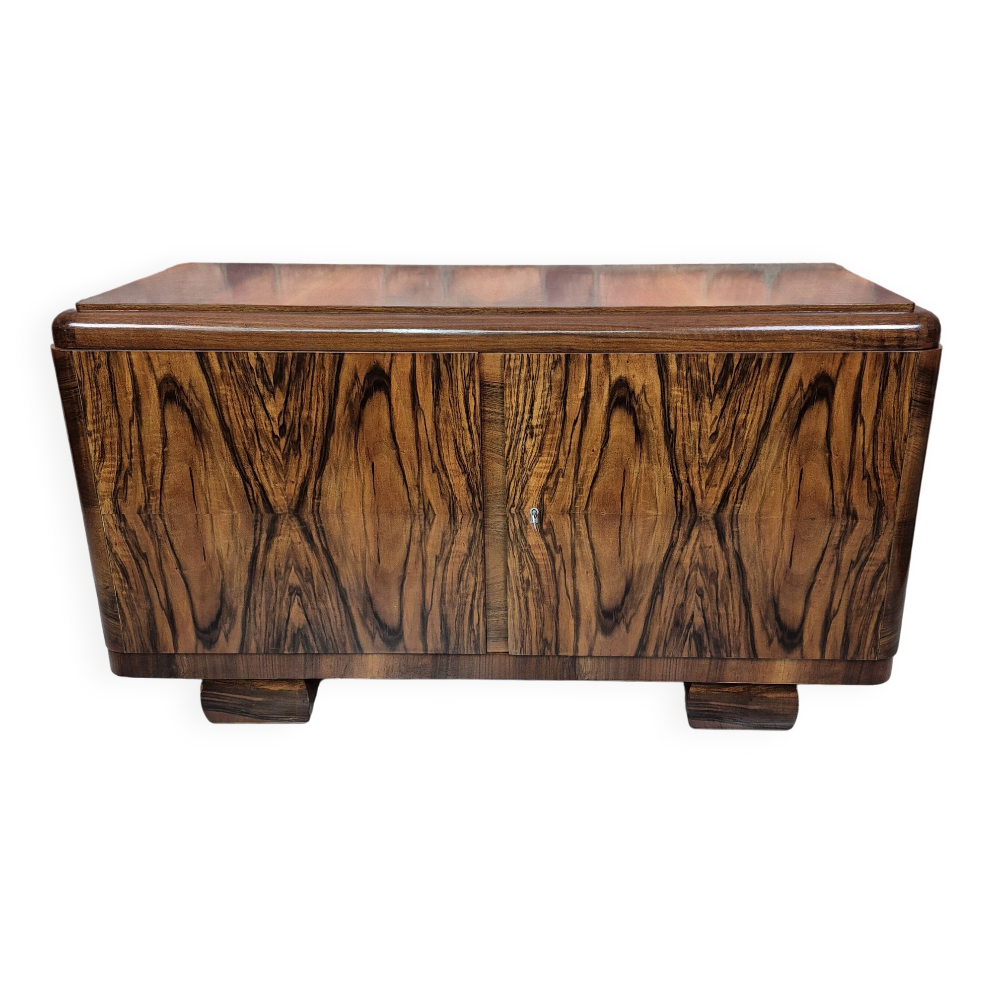 Low sideboard after renovation. Hypnotising veneer and Art Deco style.