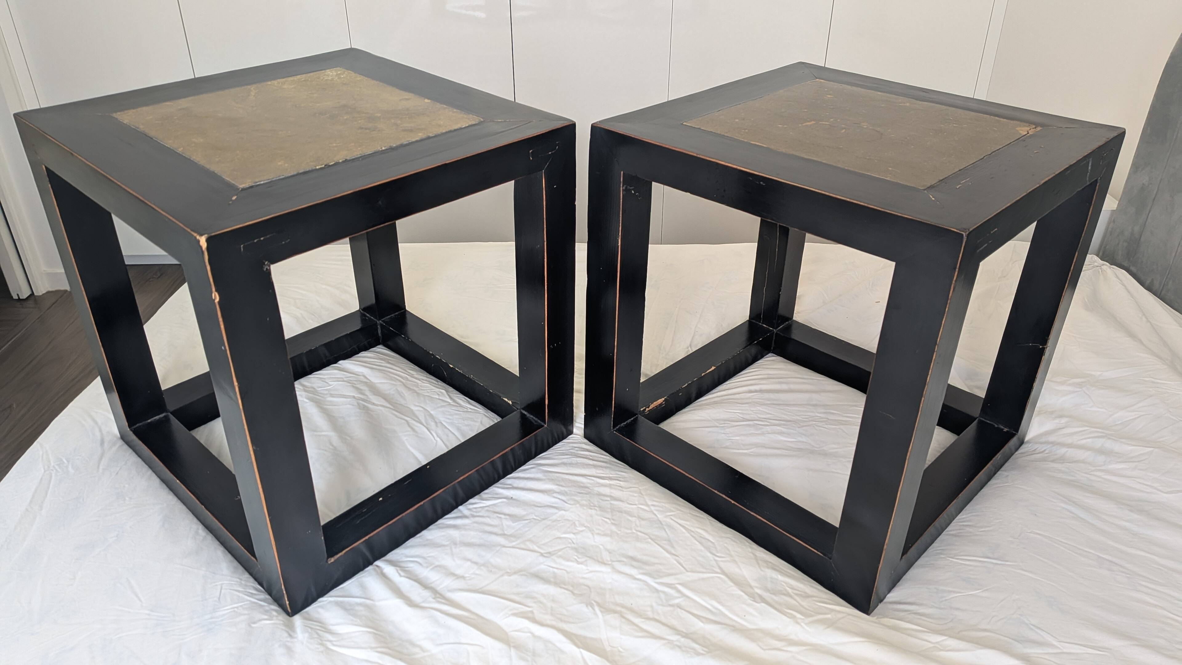 Chinese side tables in black lacquer, stone top.