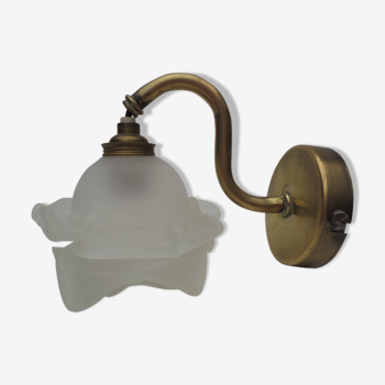 Old brass sconce with frosted glass rose