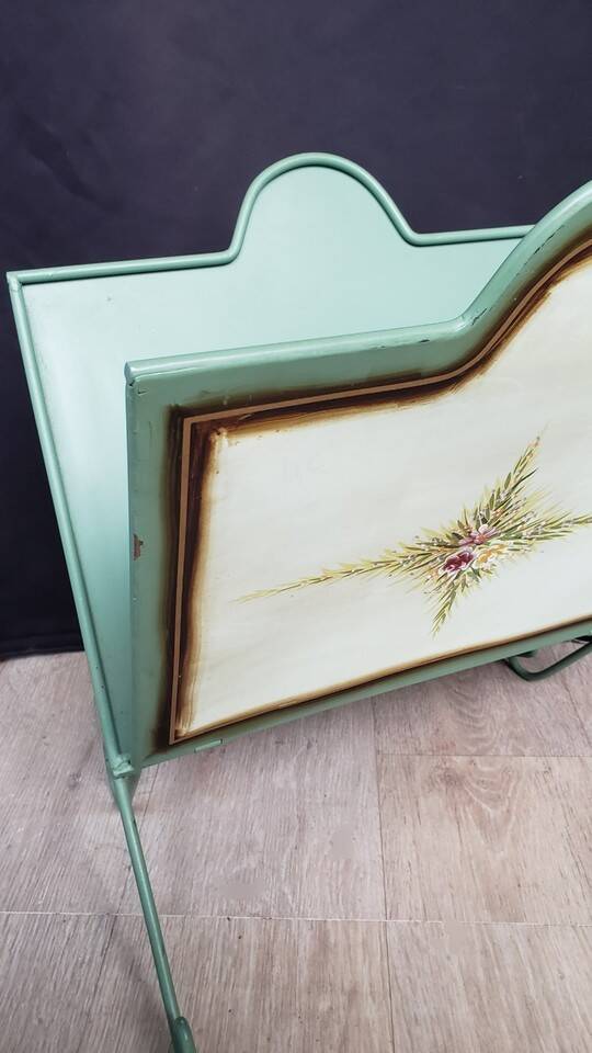 Vintage magazine rack in painted sheet metal