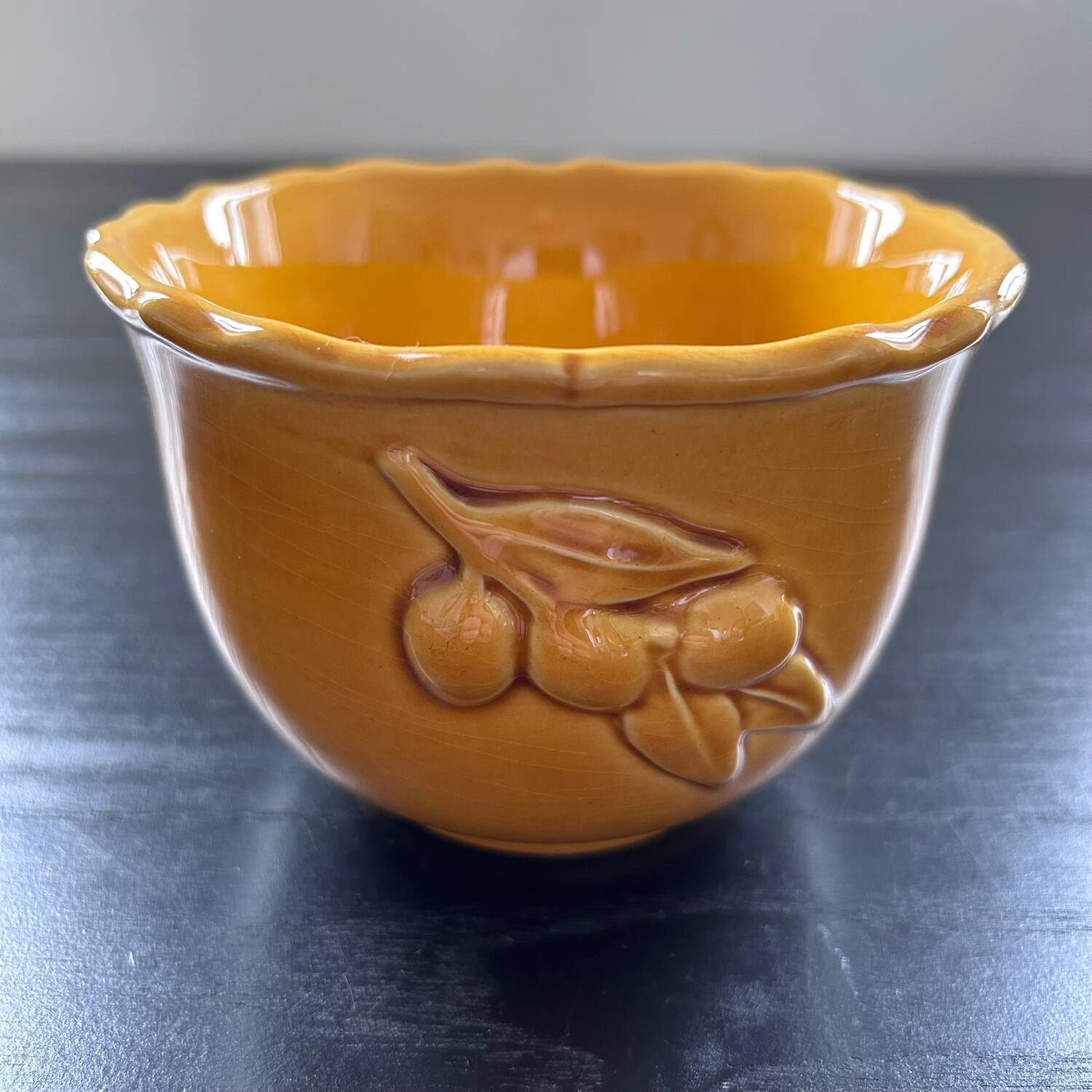 Scalloped bowl with olive decoration
