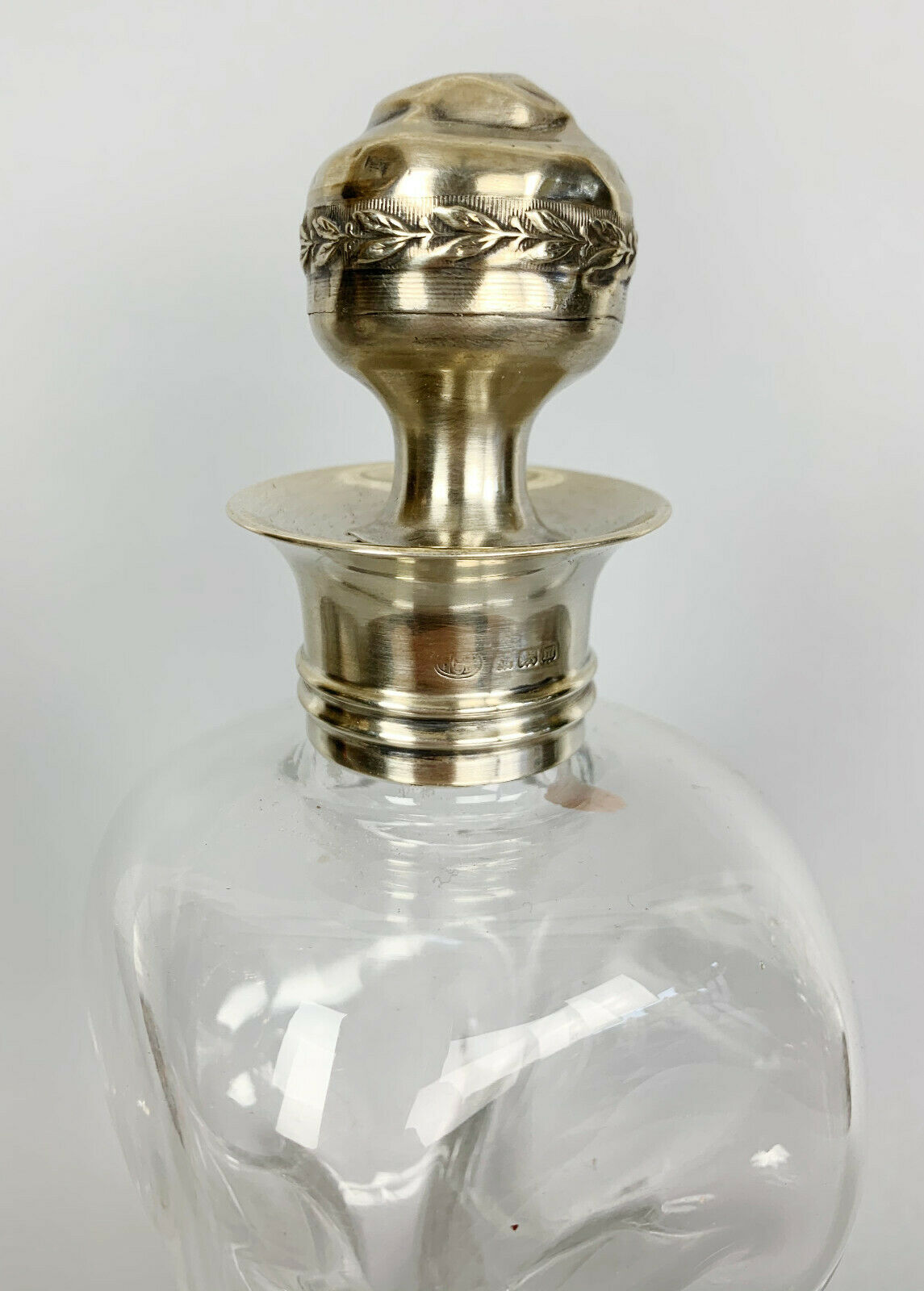 Blown glass carafe with silver frame and cap
