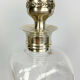 Blown glass carafe with silver frame and cap
