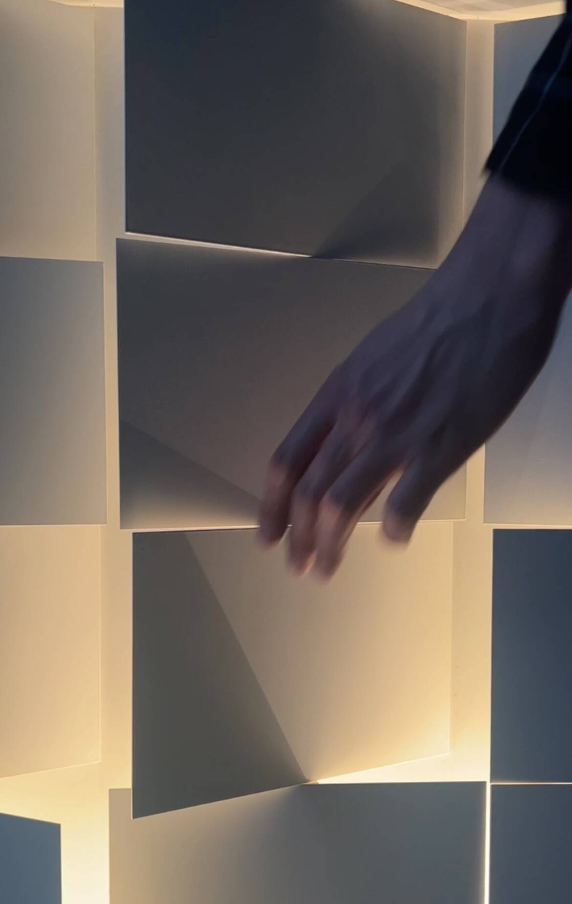 Modernist wall lamp with white metal shade, design by C. Grandidier.