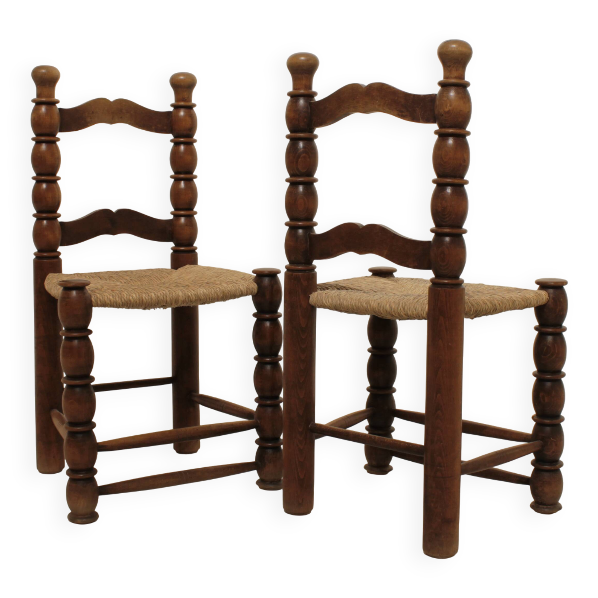 Pair of rustic chairs in turned wood with straw seats