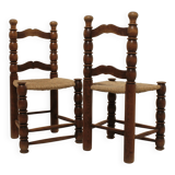 Pair of rustic chairs in turned wood with straw seats
