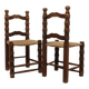 Pair of rustic chairs in turned wood with straw seats