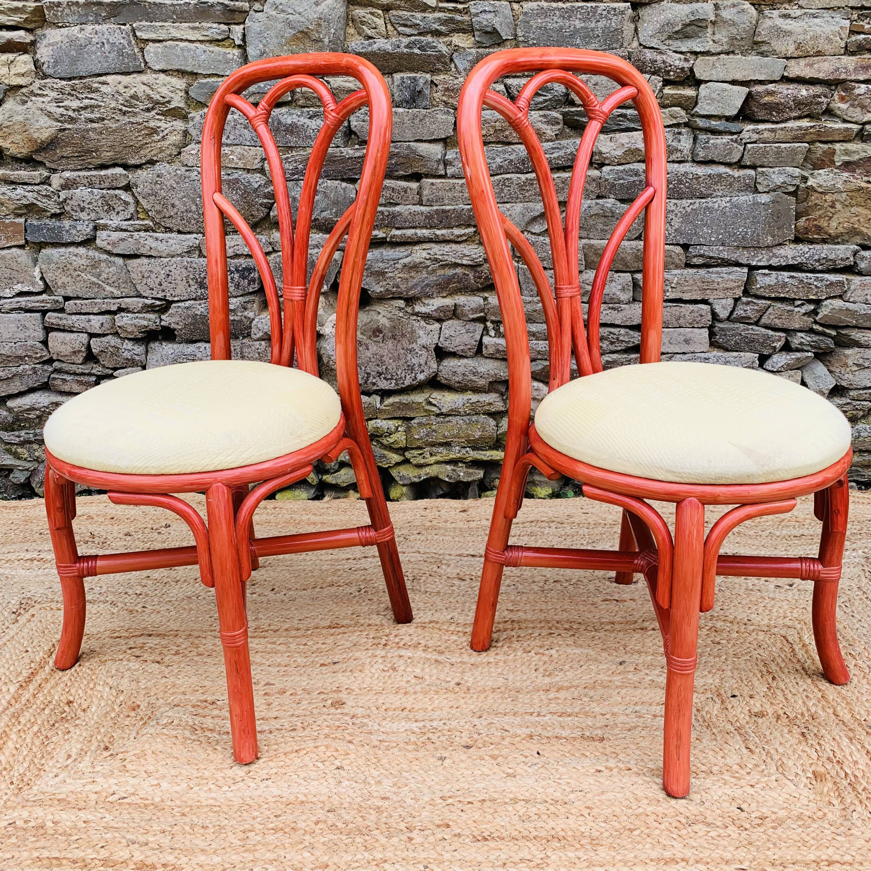 Pair of red rattan chairs and fabric