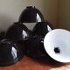 Set of 10 large industrial enamelled metal pendants.