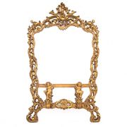A large mirror in a gold frame, Italy, first half of the 20th century.
