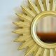 Vintage gold-colored sunburst mirror