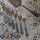 Set of 12 dessert forks and a cake server.