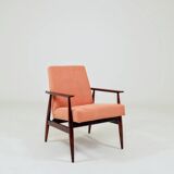 Mid-century modern armchair in coral red designed by H. Lis.