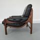 Fauteuil en teck et cuir années 1960
