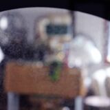 Black and gold 60s round mirror