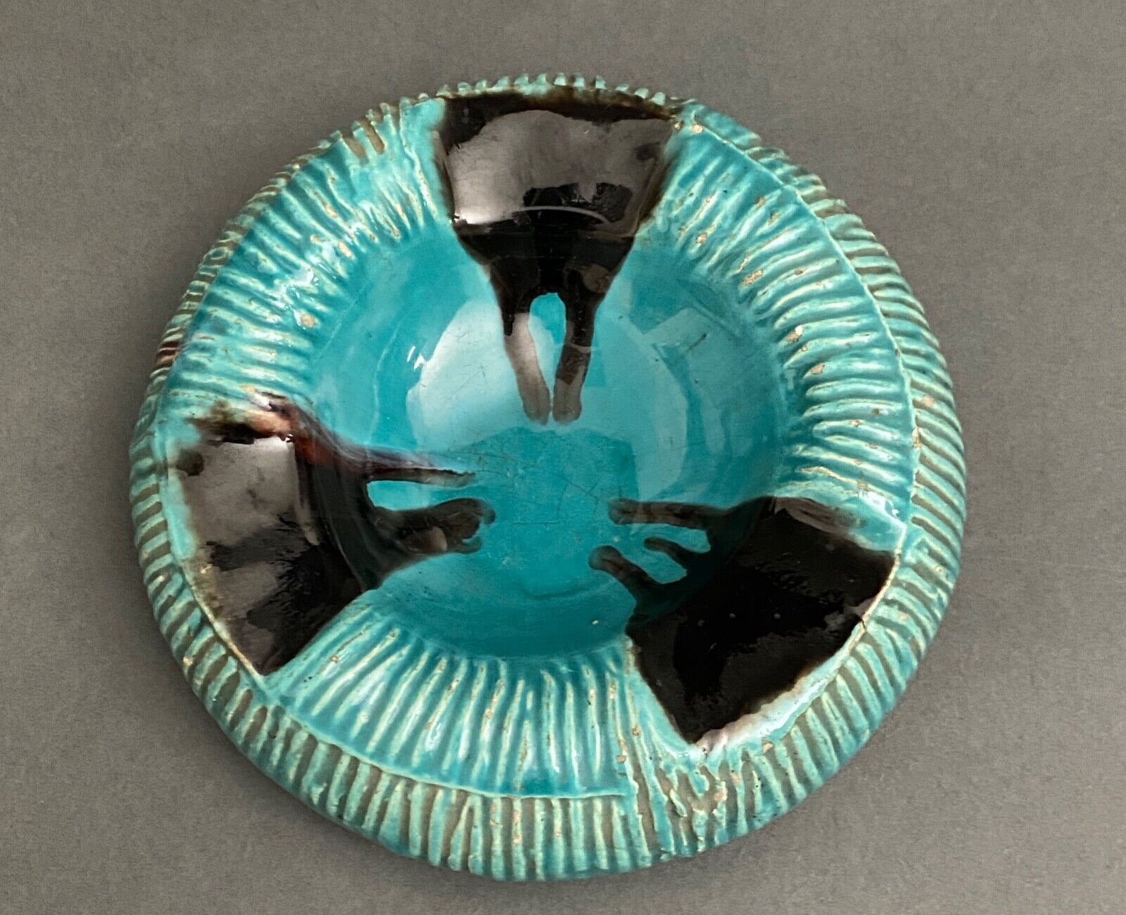 Twentieth century ceramic ashtray decorated with animals on a blue background