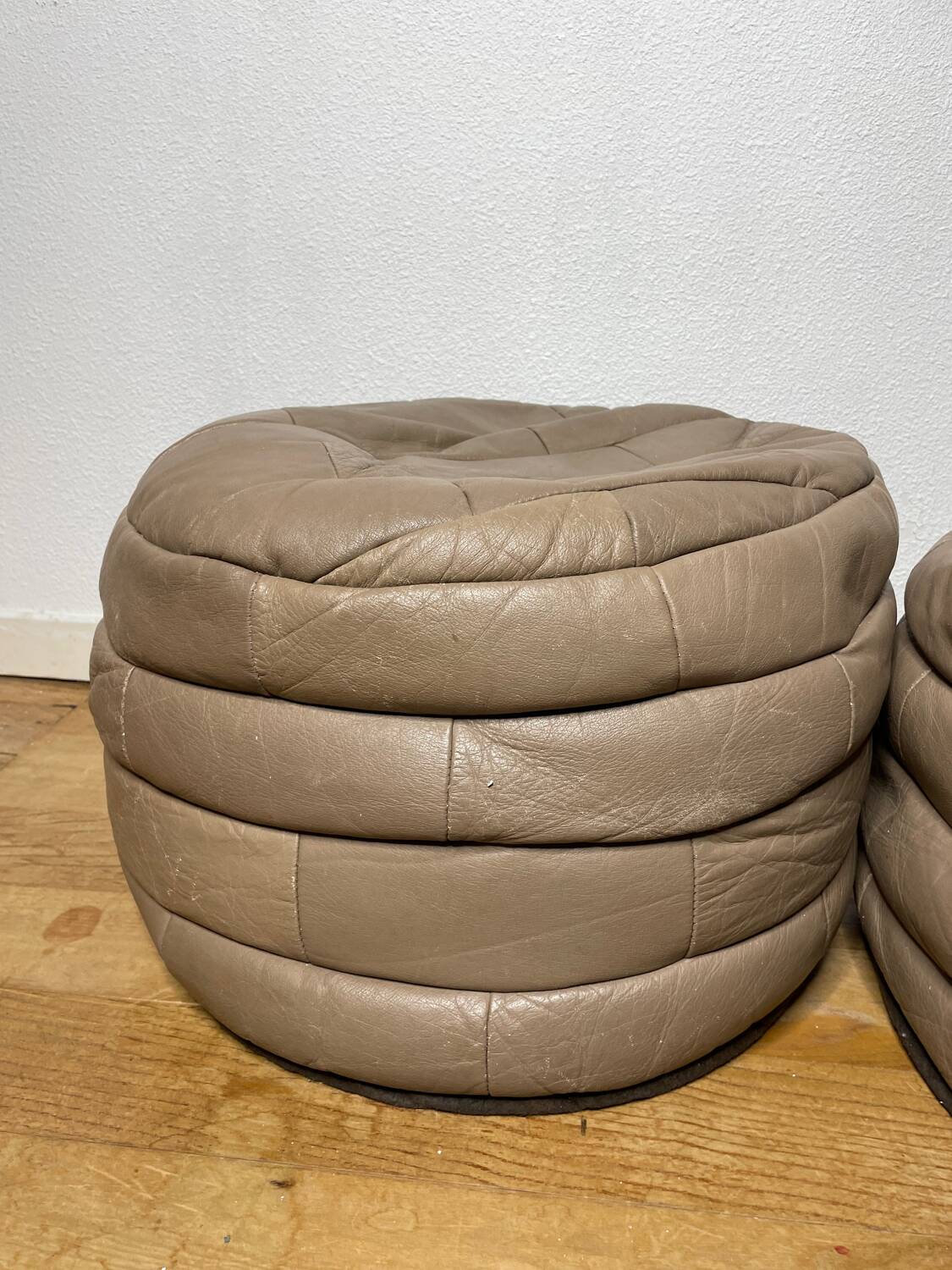 Pair of De Sède patchwork leather poufs