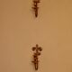 A pair of antique brass wall sconces.