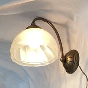 Brass wall light with a glass globe dimension: height -21cm- width -27cm-