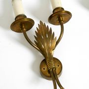 A pair of mid-century modern brass wall lamps by Vereinigte Werkstätten