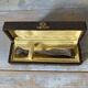 Antique sugar tongs in its case, shell decoration.