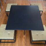 Mat black metal coffee table and 4 stackable stools.