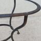 Antique bidet in enamelled sheet metal with wrought iron support