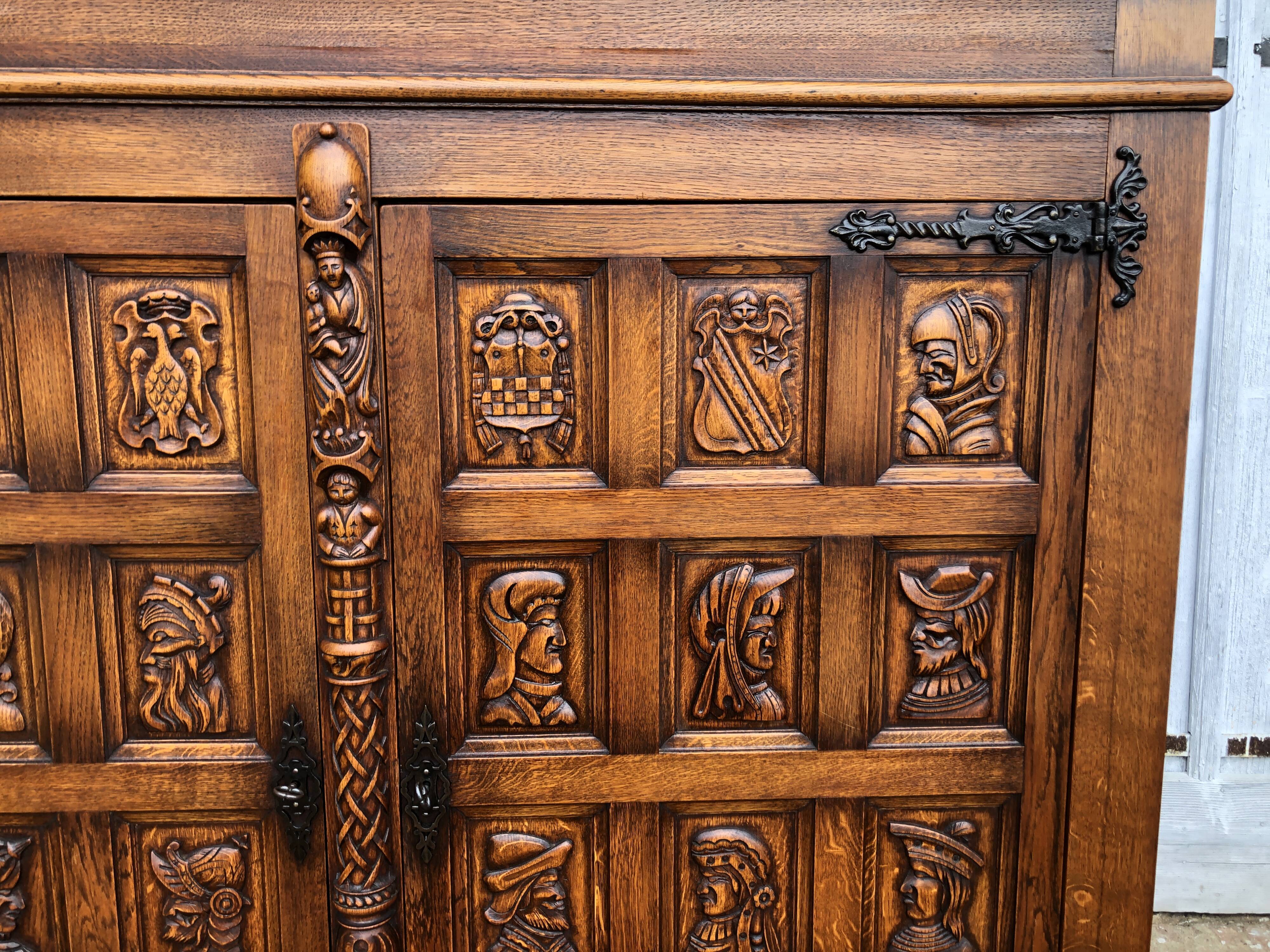 Spanish furniture with carved wood profiles and coats of arms from the 1950s.