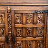 Spanish furniture with carved wood profiles and coats of arms from the 1950s.
