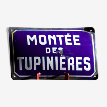 Former French street name plaque in bulging enamel led sheet "Montée des Tupinieres"