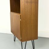 Narrow teak bookcase with two doors by Omann Jun, 1970s