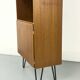 Narrow teak bookcase with two doors by Omann Jun, 1970s
