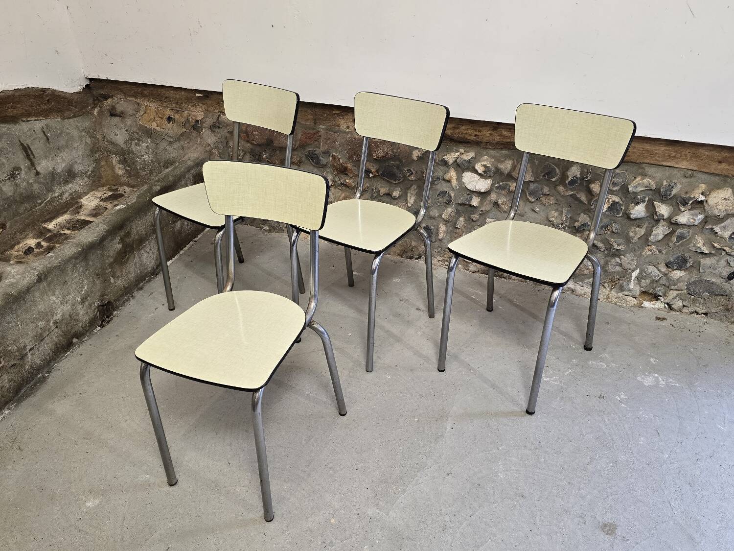 Set of 4 light yellow formica chairs