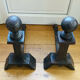 Pair of massive antique-style fire dogs in solid iron from the 20th century.