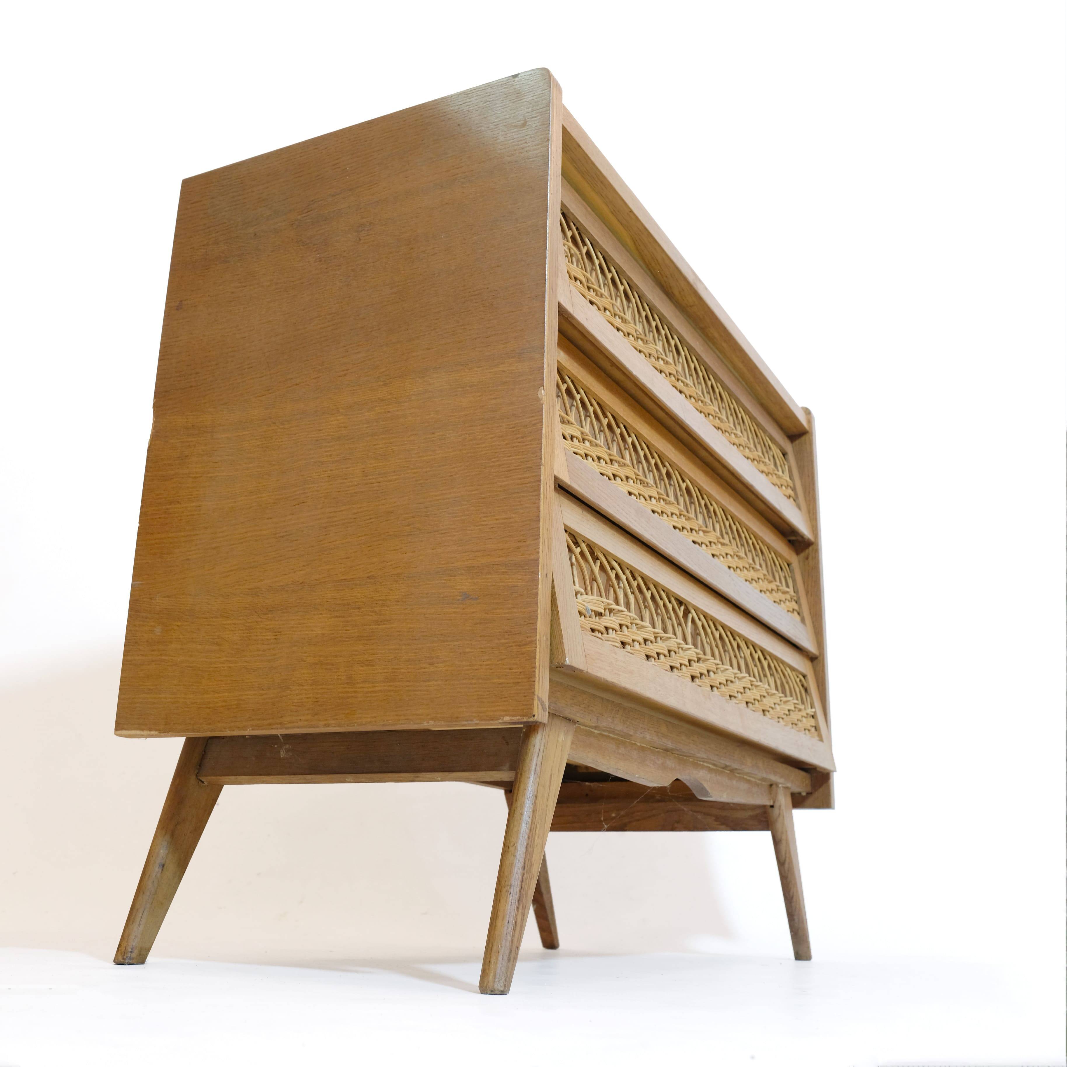 Wooden and rattan chest of drawers from the 60s.