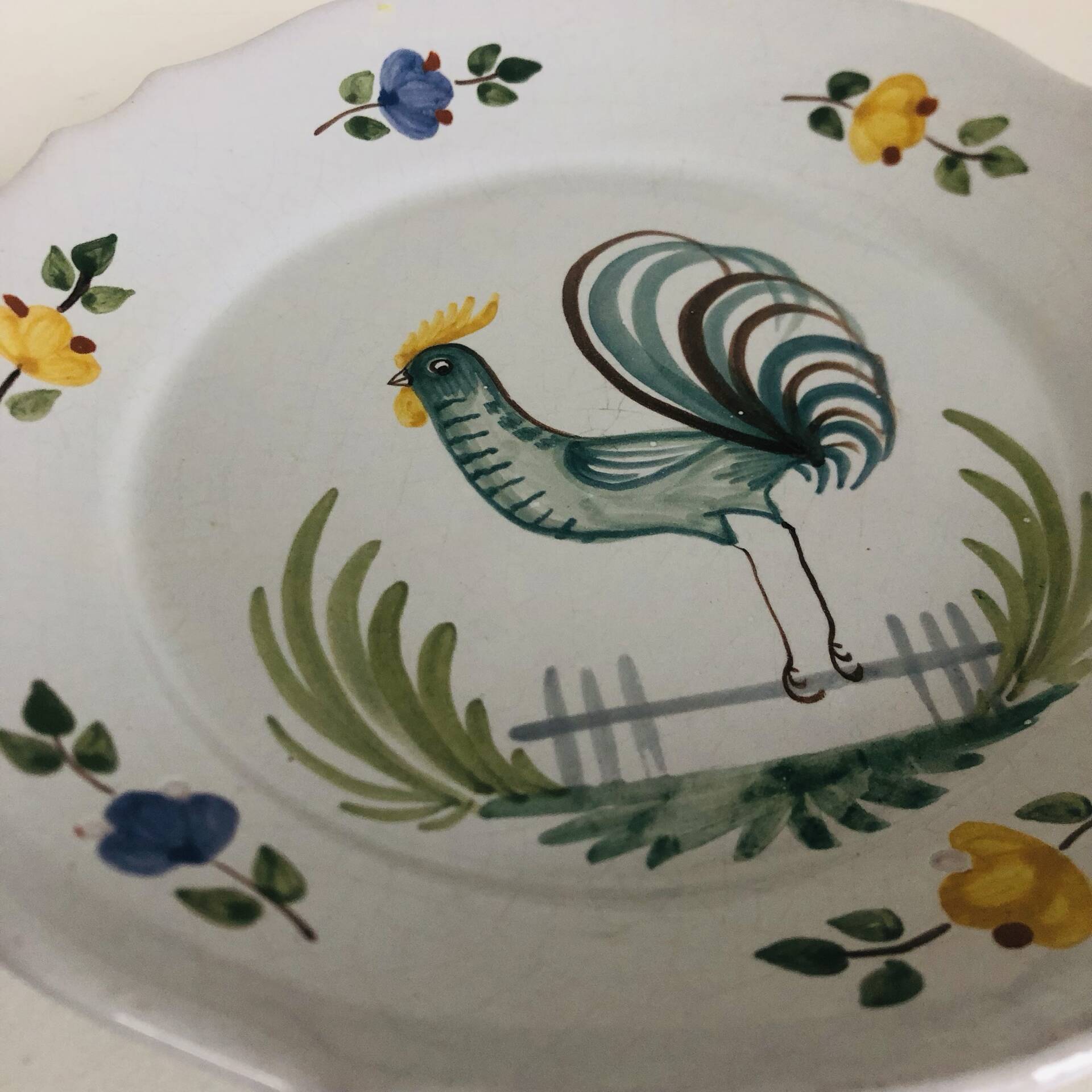 Pair of plates with naive Eastern rooster decoration