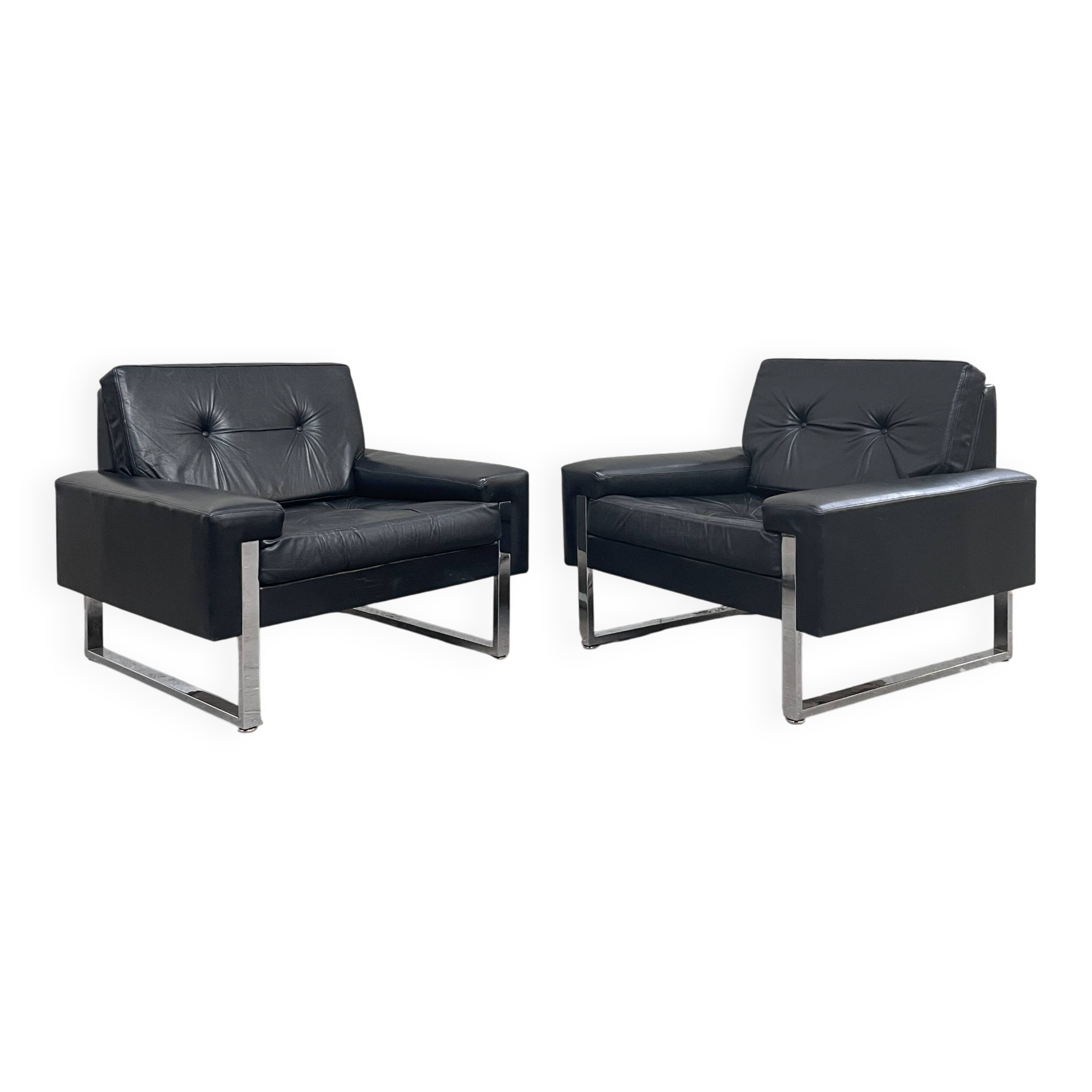 Pair of black leather armchairs