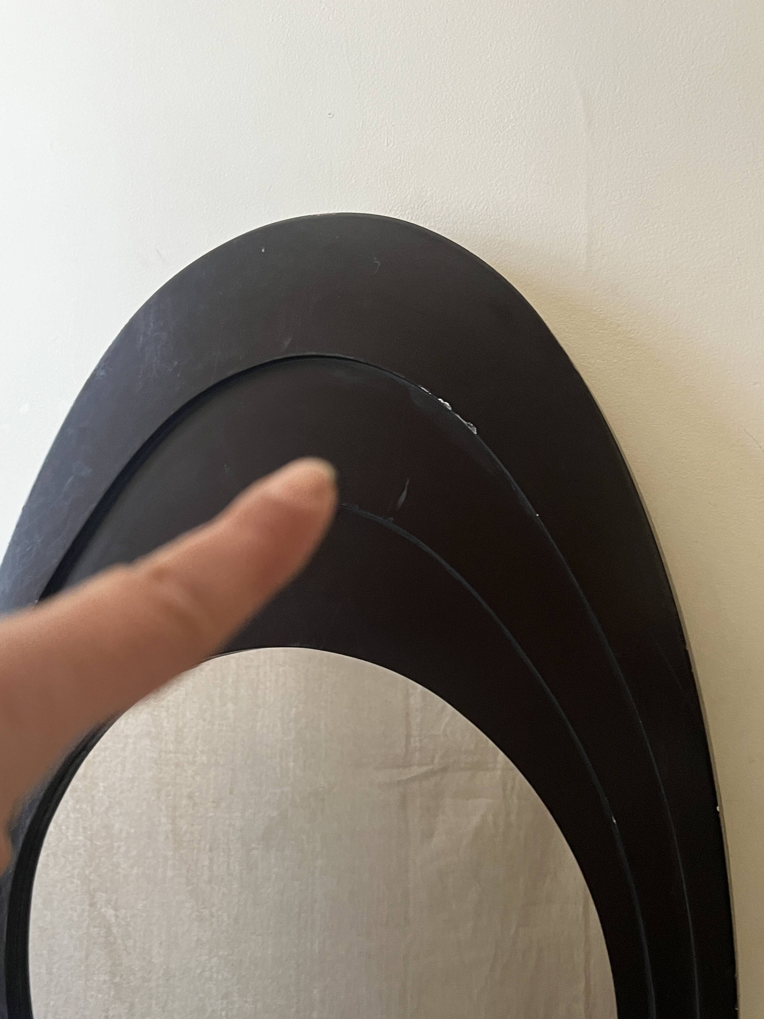 Large oval Italian mirror, modernist, space age design from the 1970s.