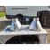 Pair of industrial pendant lights in aluminium and glass.