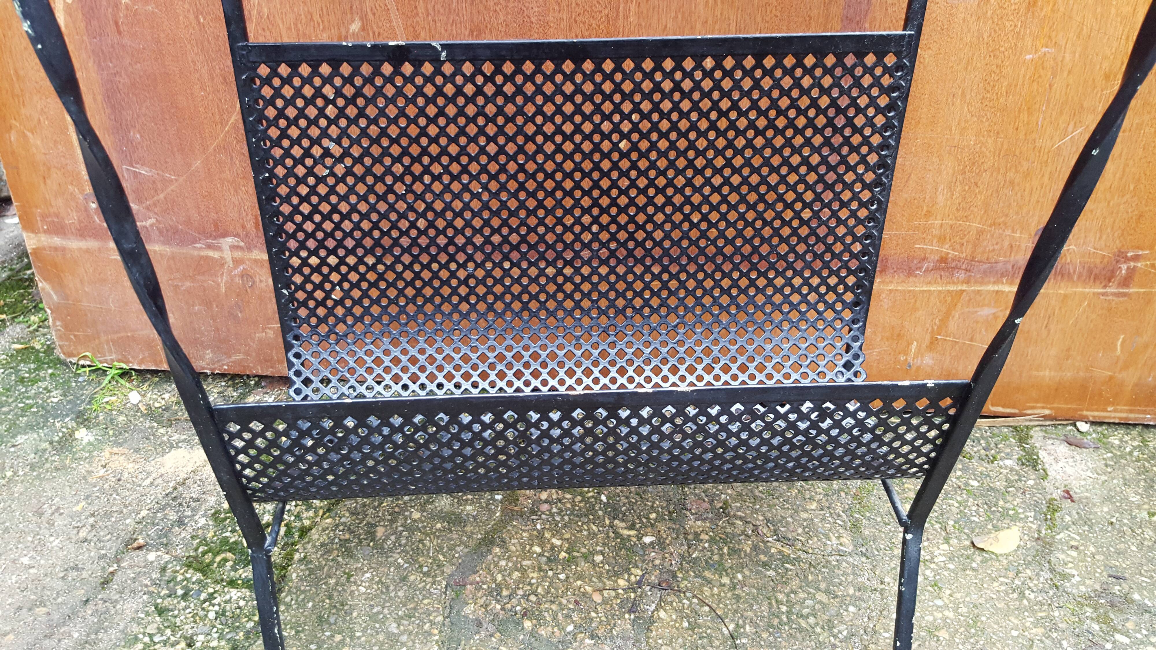 Perforated metal magazine holder design 50