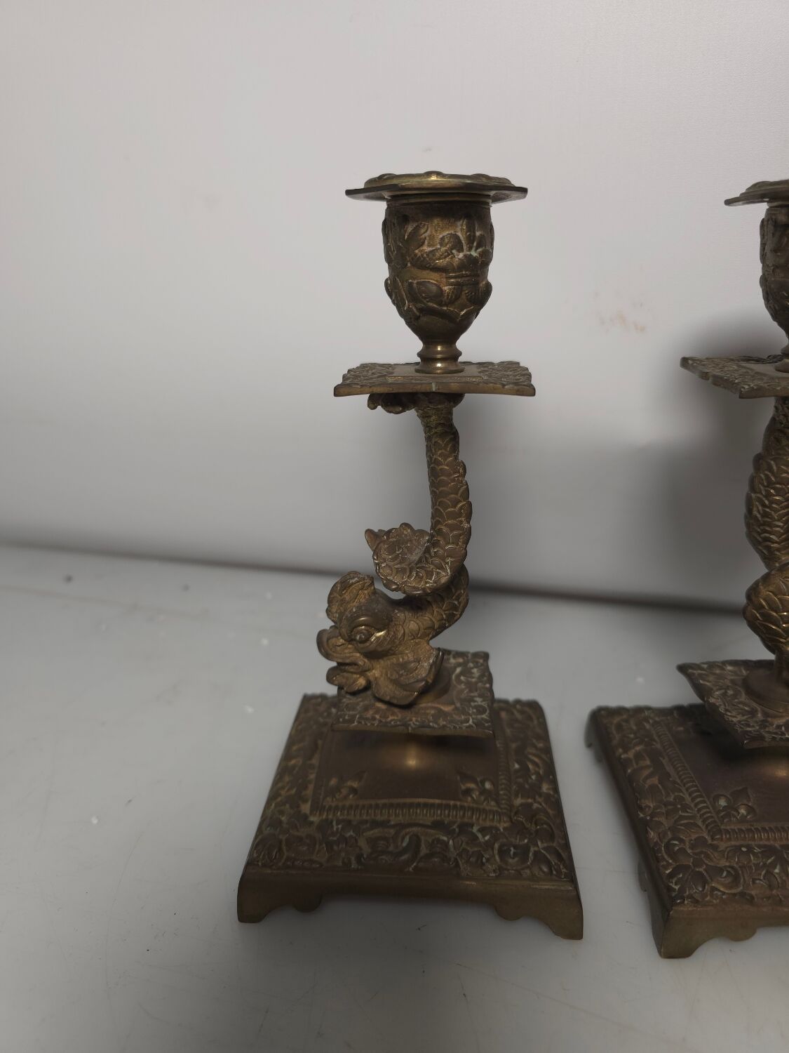 Pair of candlesticks with bronze dolphins
