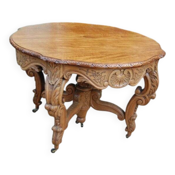Napoleon III oak table with three extensions, 12 settings, late 19th century.