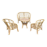Set of children's rattan garden furniture from the 1950s and 1960s, including chairs, table, and bench.