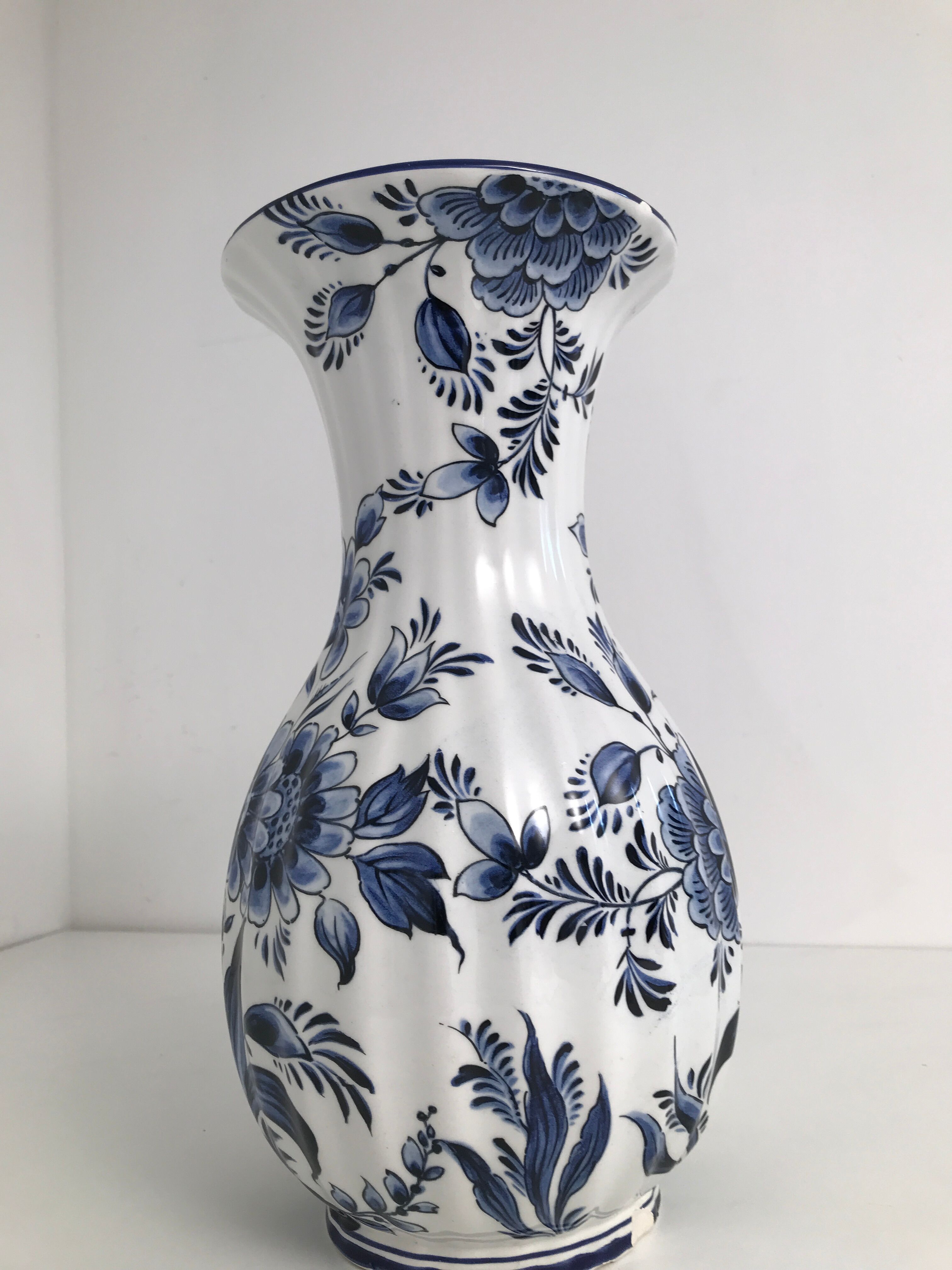 Vase with vintage blue and white flower pattern signed