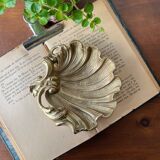 Bronze “shell” pocket emptier
