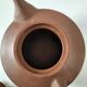 Japanese teapot in red clay engraved with integrated filter.