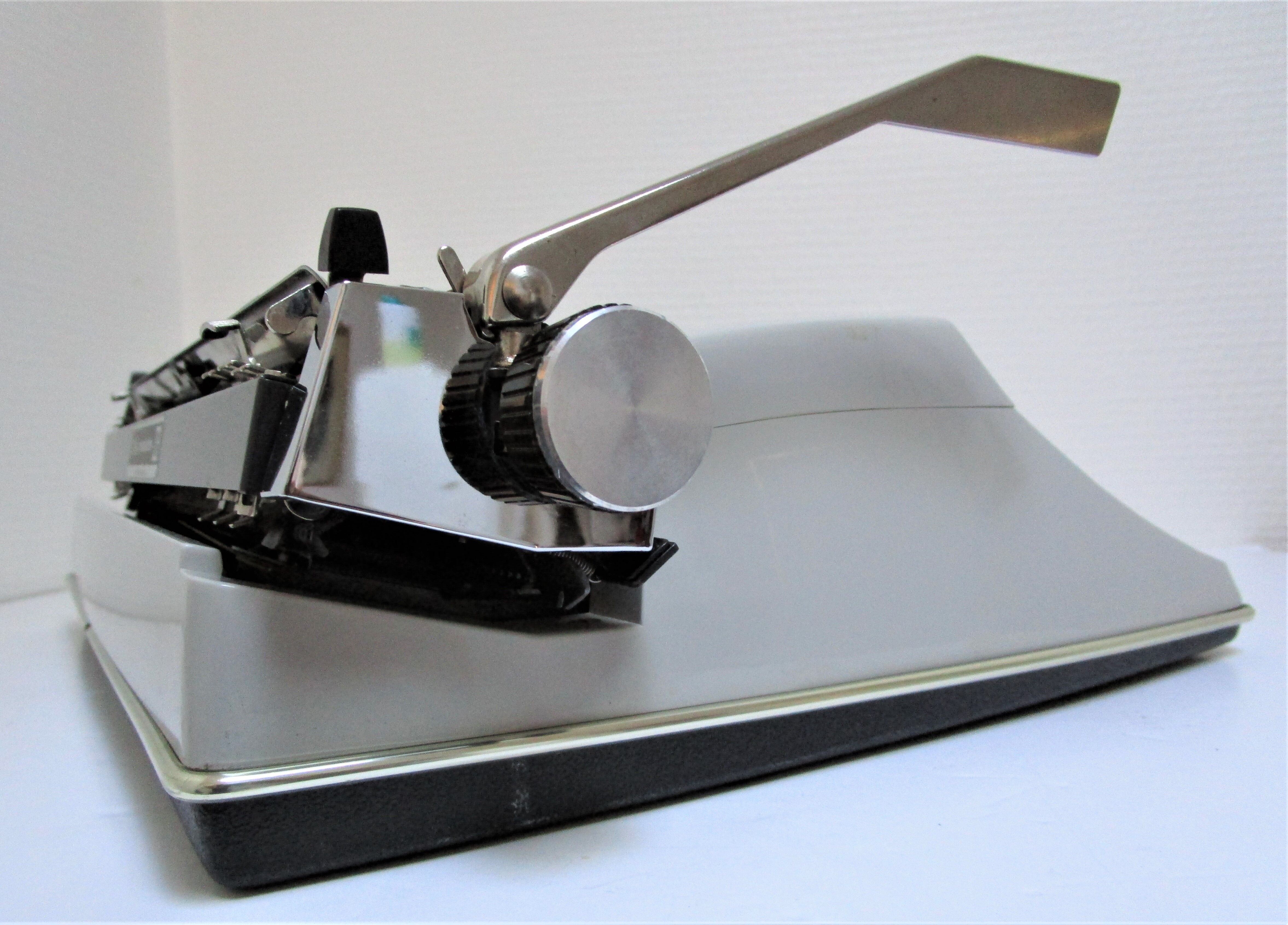 Writers' typewriters of light grey 70s Adler made in Holland